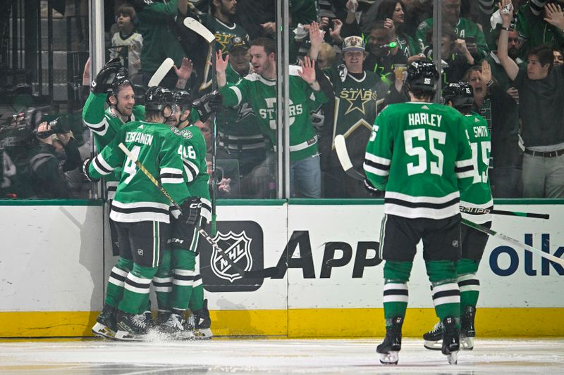 May 5, 2024; Dallas, Texas, USA; Dallas Stars center Radek Faksa (12) and defenseman Miro Heiskanen (4) and defenseman Thomas Harley (55) and center Craig Smith (15) and center Sam Steel (18) celebrates the game winning goal scored by Faksa against the Vegas Golden Knights during the third period in game seven of the first round of the 2024 Stanley Cup Playoffs at American Airlines Center. Mandatory Credit: Jerome Miron-USA TODAY Sports