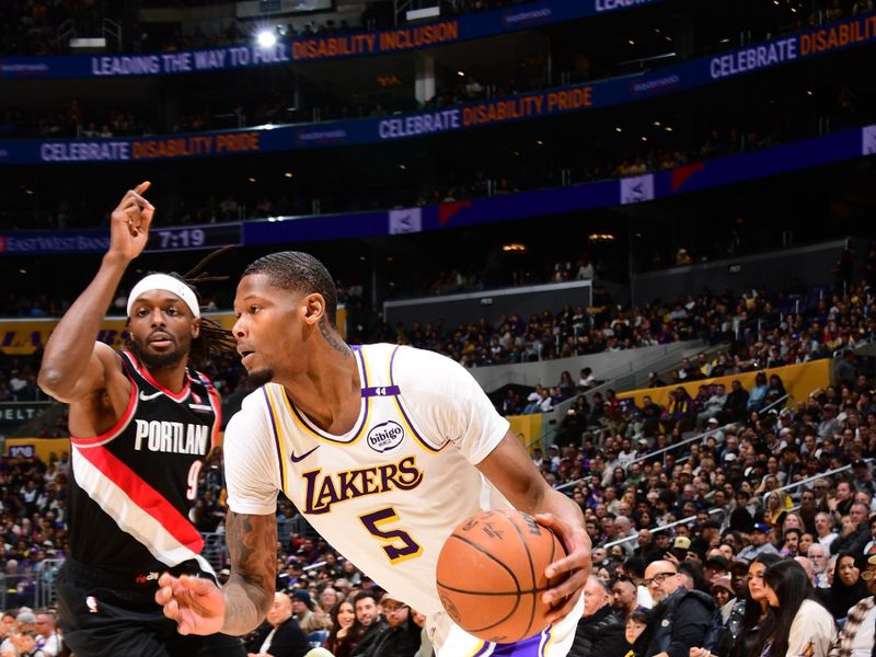 LOS ANGELES, CA - DECEMBER 8: Cam Reddish #5 of the Los Angeles Lakers drives to the basket during the game against the Portland Trail Blazers on December 8, 2024 at Crypto.Com Arena in Los Angeles, California. NOTE TO USER: User expressly acknowledges and agrees that, by downloading and/or using this Photograph, user is consenting to the terms and conditions of the Getty Images License Agreement. Mandatory Copyright Notice: Copyright 2024 NBAE (Photo by Adam Pantozzi/NBAE via Getty Images)