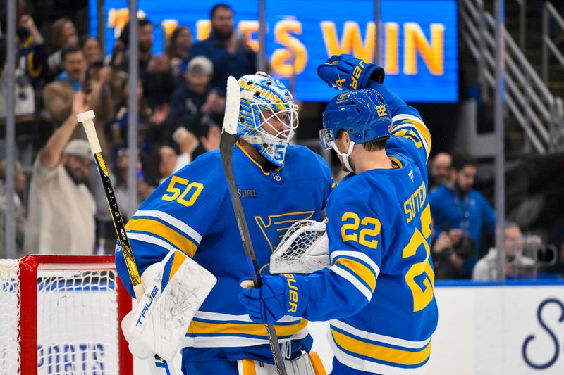 Nov 28, 2025; St. Louis, Missouri, USA; St. Louis Blues goaltender Jordan Binnington (50) celebrates with center Pius Suter (22) after the Blues defeated the Ottawa Senators at Enterprise Center. Mandatory Credit: Jeff Curry-Imagn Images