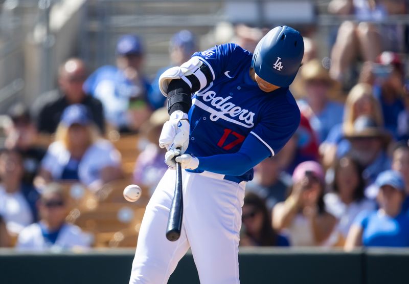 Mar 3, 2024; Phoenix, Arizona, USA; Los Angeles Dodgers designated hitter Shohei Ohtani against the Colorado Rockies during a spring training game at Camelback Ranch-Glendale. Mandatory Credit: Mark J. Rebilas-USA TODAY Sports