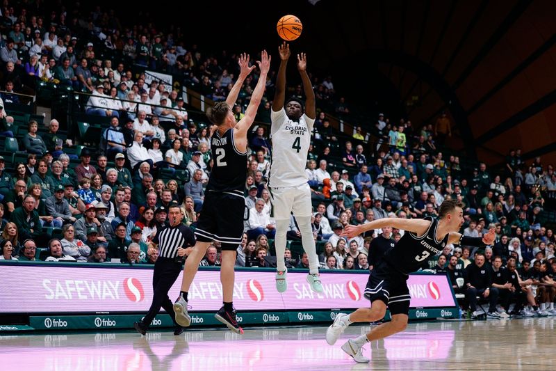 Feb 4, 2023; Fort Collins, Colorado, USA; Colorado State Rams guard Isaiah Stevens (4) attempts a shot against Utah State Aggies guard Sean Bairstow (2) as guard Steven Ashworth (3) defends in the second half at Moby Arena. Mandatory Credit: Isaiah J. Downing-USA TODAY Sports