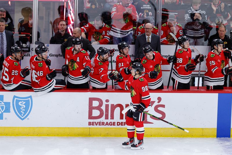 Jan 13, 2025; Chicago, Illinois, USA; Chicago Blackhawks center Connor Bedard (98) celebrates with teammates after scoring against the Calgary Flames during the second period at United Center. Mandatory Credit: Kamil Krzaczynski-Imagn Images