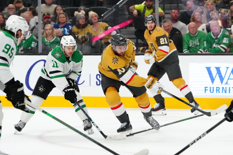 Dec 6, 2024; Las Vegas, Nevada, USA; Vegas Golden Knights center Nicolas Roy (10) scores on a shot against the Dallas Stars during the second period at T-Mobile Arena. Mandatory Credit: Stephen R. Sylvanie-Imagn Images