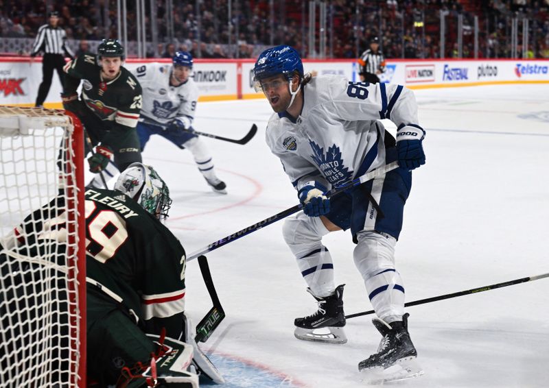 Nov 19, 2023; Stockholm, SWE; Toronto Maple Leafs right wing William Nylander (88) shoots and scores a goal against Minnesota Wild goaltender Marc-Andre Fleury (29) during a Global Series NHL hockey game at Avicii Arena. Mandatory Credit: Per Haljestam-USA TODAY Sports