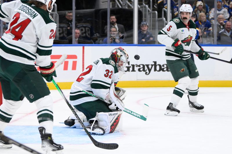 Oct 15, 2024; St. Louis, Missouri, USA; Minnesota Wild goaltender Filip Gustavsson (32) makes a save against the St. Louis Blues during the second period at Enterprise Center. Mandatory Credit: Jeff Le-Imagn Images