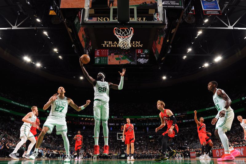 BOSTON, MA - OCTOBER 13: Neemias Queta #88 of the Boston Celtics goes up for the rebound during the game against the Toronto Raptors during a NBA pre season game on October 13, 2024 at TD Garden in Boston, Massachusetts. NOTE TO USER: User expressly acknowledges and agrees that, by downloading and/or using this Photograph, user is consenting to the terms and conditions of the Getty Images License Agreement. Mandatory Copyright Notice: Copyright 2024 NBAE (Photo by Brian Babineau/NBAE via Getty Images)