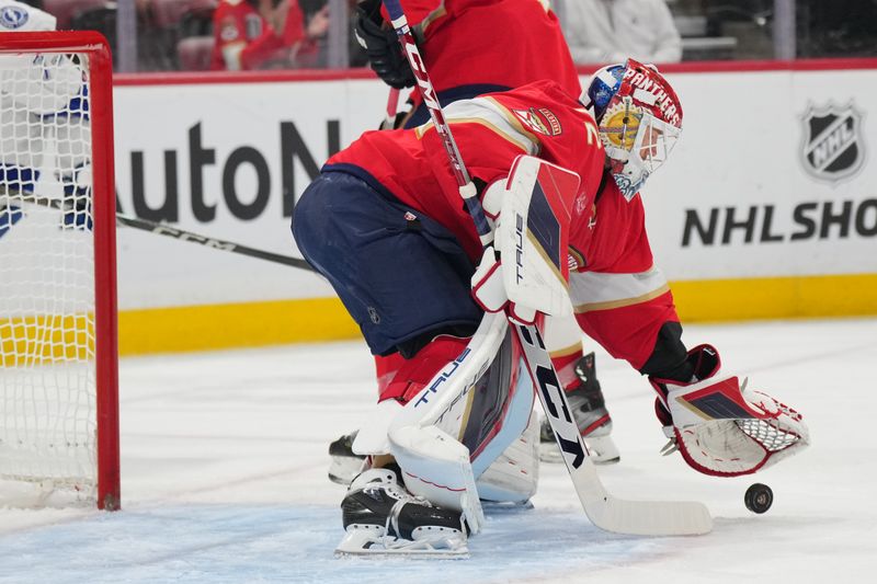 Sep 30, 2024; Sunrise, Florida, USA; Florida Panthers goaltender Sergei Bobrovsky (72) makes a save against the Tampa Bay Lightning during the first period at Amerant Bank Arena. Mandatory Credit: Jim Rassol-Imagn Images