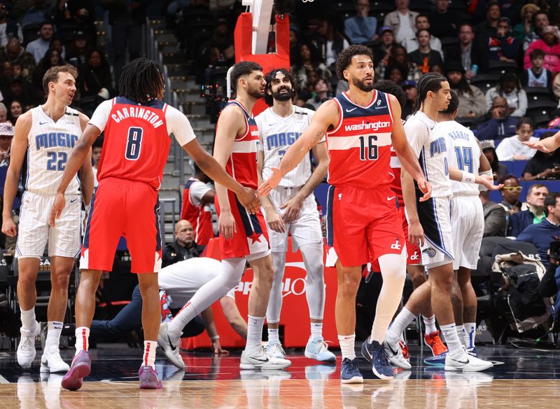 WASHINGTON, DC -?MARCH 21: Anthony Gill #16 & Bub Carrington #8 of the Washington Wizards high five during the game on March 21, 2025 at Capital One Arena in Washington, DC. NOTE TO USER: User expressly acknowledges and agrees that, by downloading and or using this Photograph, user is consenting to the terms and conditions of the Getty Images License Agreement. Mandatory Copyright Notice: Copyright 2025 NBAE (Photo by Kenny Giarla/NBAE via Getty Images)