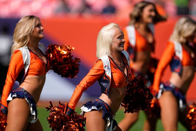 Denver Broncos cheerleaders dance during an NFL football game against the Los Angeles Chargers, Sunday, Oct. 13, 2024, in Denver. (AP Photo/David Zalubowski)