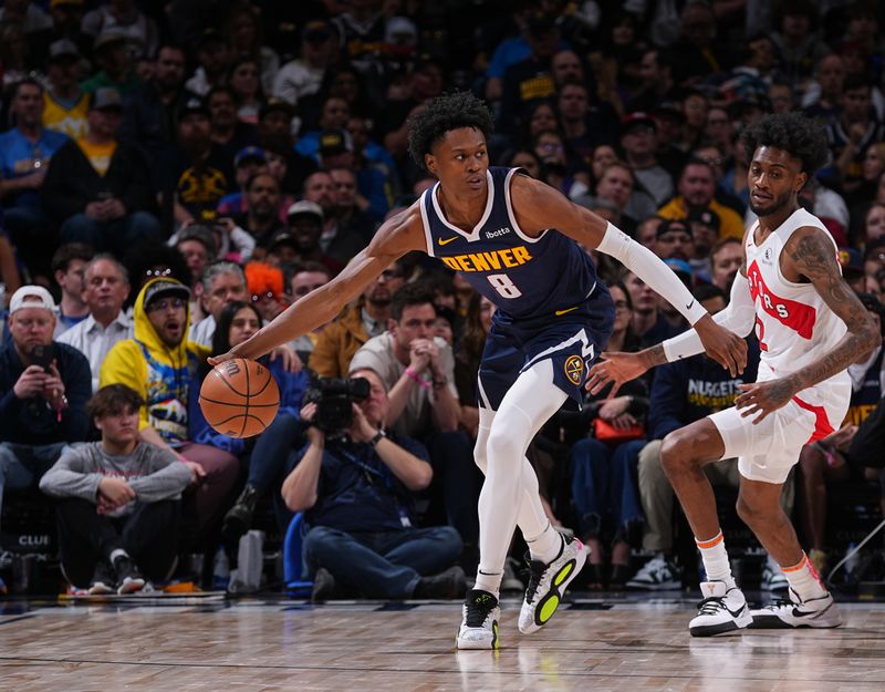 DENVER, CO - MARCH 11: Peyton Watson #8 of the Denver Nuggets handles the ball during the game against the Toronto Raptors on March 11, 2024 at the Ball Arena in Denver, Colorado. NOTE TO USER: User expressly acknowledges and agrees that, by downloading and/or using this Photograph, user is consenting to the terms and conditions of the Getty Images License Agreement. Mandatory Copyright Notice: Copyright 2024 NBAE (Photo by Bart Young/NBAE via Getty Images)