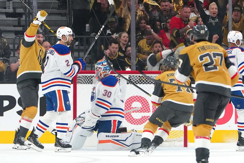 May 6, 2025; Las Vegas, Nevada, USA; Vegas Golden Knights right wing Mark Stone (61) celebrates behind Edmonton Oilers defenseman Evan Bouchard (2) after scoring a goal against goaltender Calvin Pickard (30) during the first period of game one of the second round of the 2025 Stanley Cup Playoffs at T-Mobile Arena. Mandatory Credit: Stephen R. Sylvanie-Imagn Images