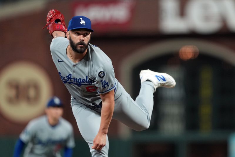 Sep 12, 2025; San Francisco, California, USA; Los Angeles Dodgers pitcher Tanner Scott (66) throws a pitch against the San Francisco Giants during the tenth inning at Oracle Park. Mandatory Credit: Darren Yamashita-Imagn Images