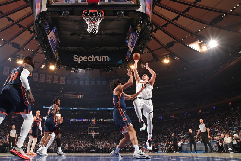 NEW YORK, NY - JANUARY 25: Nikola Jokic #15 of the Denver Nuggets shoots the ball during the game against the New York Knicks on January 25, 2024 at Madison Square Garden in New York City, New York.  NOTE TO USER: User expressly acknowledges and agrees that, by downloading and or using this photograph, User is consenting to the terms and conditions of the Getty Images License Agreement. Mandatory Copyright Notice: Copyright 2024 NBAE  (Photo by Nathaniel S. Butler/NBAE via Getty Images)