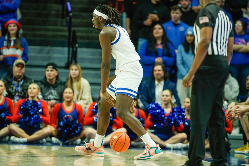 Jan 9, 2024; Boise, Idaho, USA; Boise State Broncos forward O'Mar Stanley (1) dribbles during the first half against the Colorado State Rams at ExtraMile Arena. Mandatory Credit: Brian Losness-USA TODAY Sports


