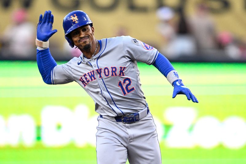 Aug 22, 2024; San Diego, California, USA; New York Mets shortstop Francisco Lindor (12) celebrates after hitting a double against the San Diego Padres during the first inning at Petco Park. Mandatory Credit: Orlando Ramirez-USA TODAY Sports