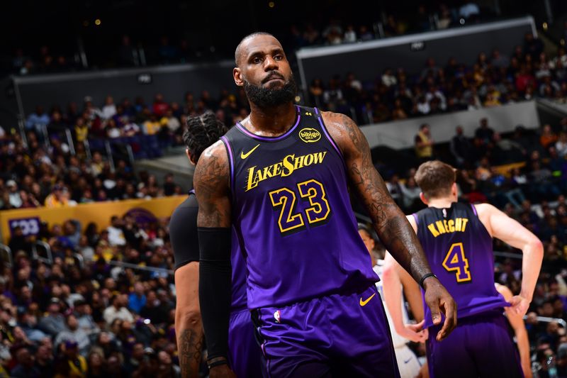 LOS ANGELES, CA - NOVEMBER 21: LeBron James #23 of the Los Angeles Lakers looks on during the game against the Orlando Magic on November 21, 2024 at Crypto.Com Arena in Los Angeles, California. NOTE TO USER: User expressly acknowledges and agrees that, by downloading and/or using this Photograph, user is consenting to the terms and conditions of the Getty Images License Agreement. Mandatory Copyright Notice: Copyright 2024 NBAE (Photo by Adam Pantozzi/NBAE via Getty Images)