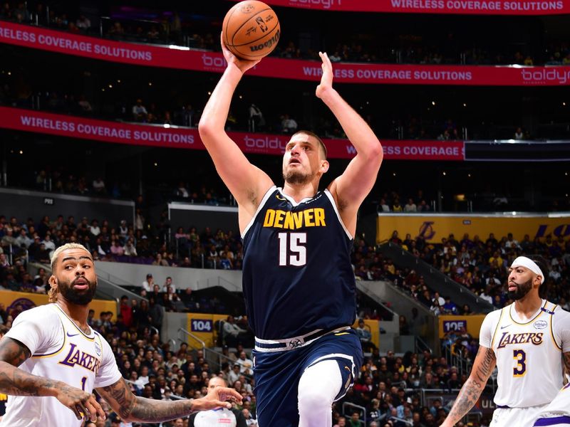 LOS ANGELES, CA - NOVEMBER 23: Nikola Jokic #15 of the Denver Nuggets drives to the basket during the game against the Los Angeles Lakers on November 23, 2024 at Crypto.Com Arena in Los Angeles, California. NOTE TO USER: User expressly acknowledges and agrees that, by downloading and/or using this Photograph, user is consenting to the terms and conditions of the Getty Images License Agreement. Mandatory Copyright Notice: Copyright 2024 NBAE (Photo by Adam Pantozzi/NBAE via Getty Images)