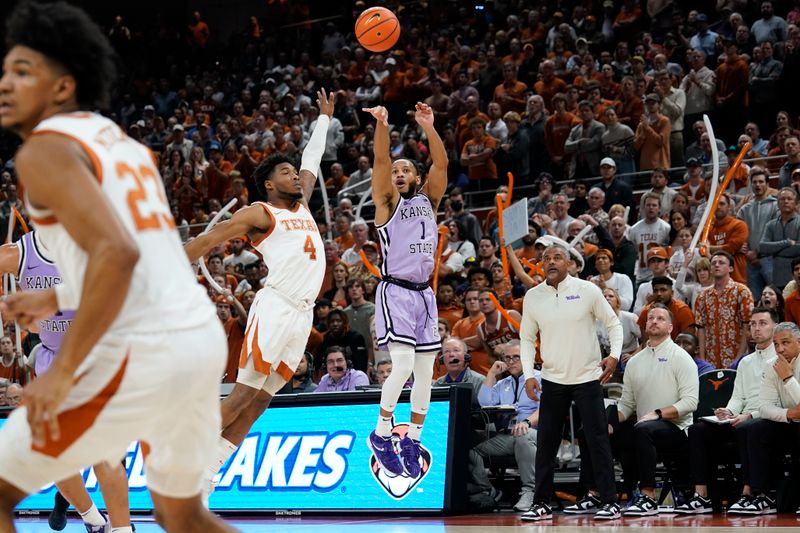 Jan 3, 2023; Austin, Texas, USA; Kansas State Wildcats guard Markquis Nowell (1) shoots over Texas Longhorns guard Tyrese Hunter (4) during the second half at Moody Center. Mandatory Credit: Scott Wachter-USA TODAY Sports