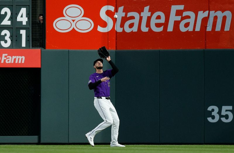 Apr 8, 2024; Denver, Colorado, USA; Colorado Rockies right fielder Kris Bryant (23) makes a catch for an out in the fourth inning against the Arizona Diamondbacks at Coors Field. Mandatory Credit: Isaiah J. Downing-USA TODAY Sports