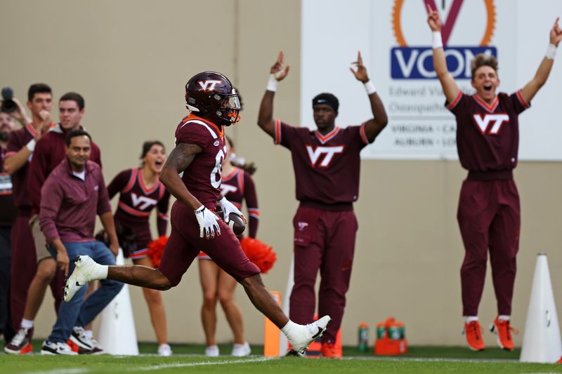 Oct 14, 2023; Blacksburg, Virginia, USA; Virginia Tech Hokies wide receiver Jaylin Lane (83) scores a touchdown during the second quarter against the Wake Forest Demon Deacons at Lane Stadium. Mandatory Credit: Peter Casey-USA TODAY Sports