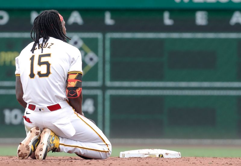 Sep 26, 2024; Pittsburgh, Pennsylvania, USA;  Pittsburgh Pirates center fielder Oneil Cruz (15) reacts after being tagged out on a double play made possible by Cruz rounding second base too far against the Milwaukee Brewers during the eighth inning at PNC Park. The Brewers won 5-2. Mandatory Credit: Charles LeClaire-Imagn Images