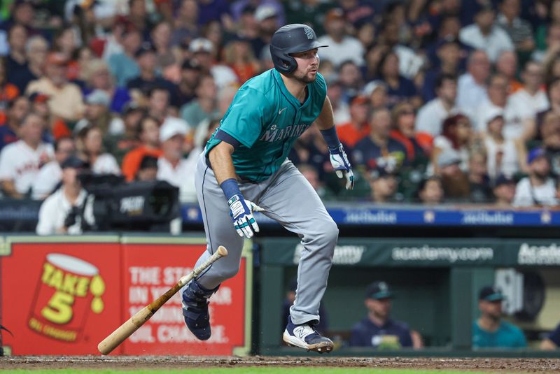 Sep 23, 2024; Houston, Texas, USA; Seattle Mariners catcher Cal Raleigh (29) hits an RBI single during the third inning against the Houston Astros at Minute Maid Park. Mandatory Credit: Troy Taormina-Imagn Images