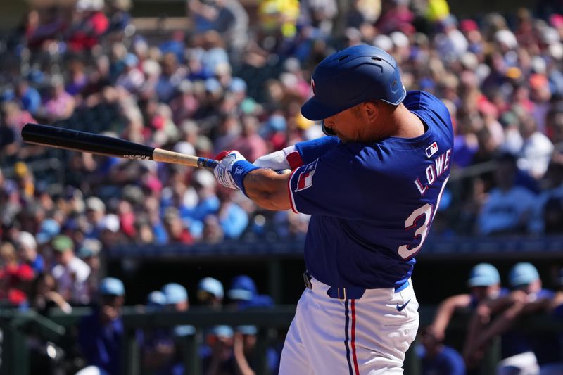 Mar 4, 2024; Surprise, Arizona, USA; Texas Rangers first baseman Nathaniel Lowe (30) bats against the Los Angeles Angels during the first inning at Surprise Stadium. Mandatory Credit: Joe Camporeale-USA TODAY Sports