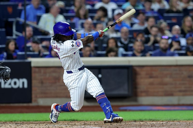 Sep 18, 2024; New York City, New York, USA; New York Mets shortstop Luisangel Acuna (2) follows through on an RBI single against the Washington Nationals during the fourth inning at Citi Field. Mandatory Credit: Brad Penner-Imagn Images