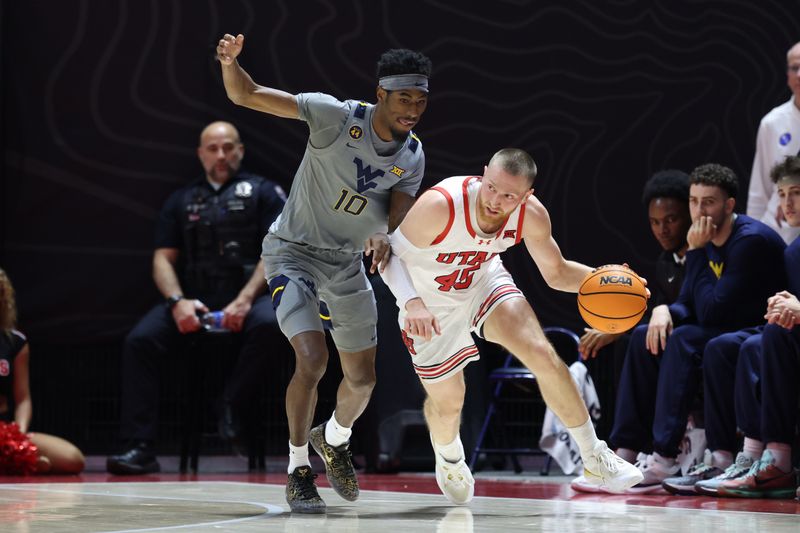 Mar 4, 2025; Salt Lake City, Utah, USA; Utah Utes guard Mason Madsen (45) dribbles against West Virginia Mountaineers guard Sencire Harris (10) during the first half at Jon M. Huntsman Center. Mandatory Credit: Rob Gray-Imagn Images