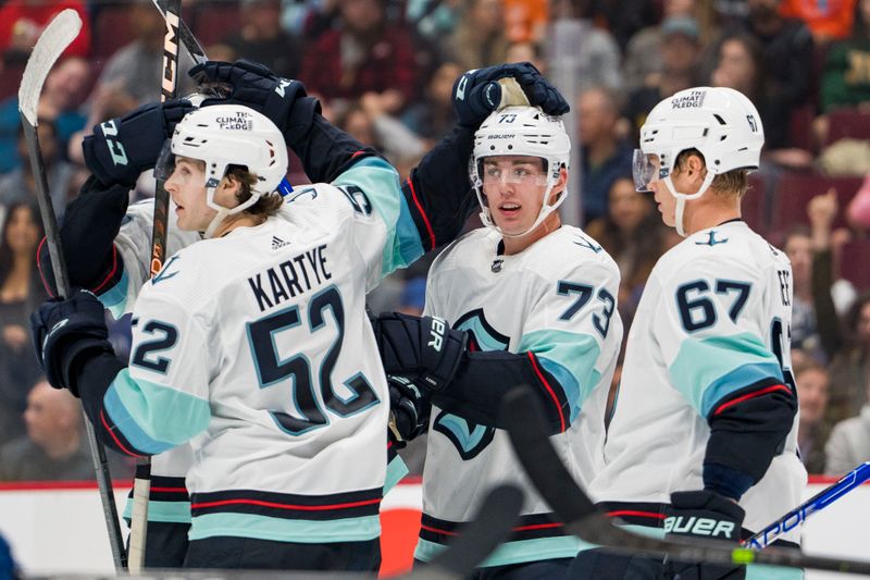 Sep 29, 2022; Vancouver, British Columbia, CAN; Seattle Kraken forward Tye Kartye (52) and forward Kole Lind (73) and forward Morgan Geekie (67) celebrate Lind   s goal against the Vancouver Canucks in the third period at Rogers Arena. Seattle won 4-3 in overtime. Mandatory Credit: Bob Frid-USA TODAY Sports