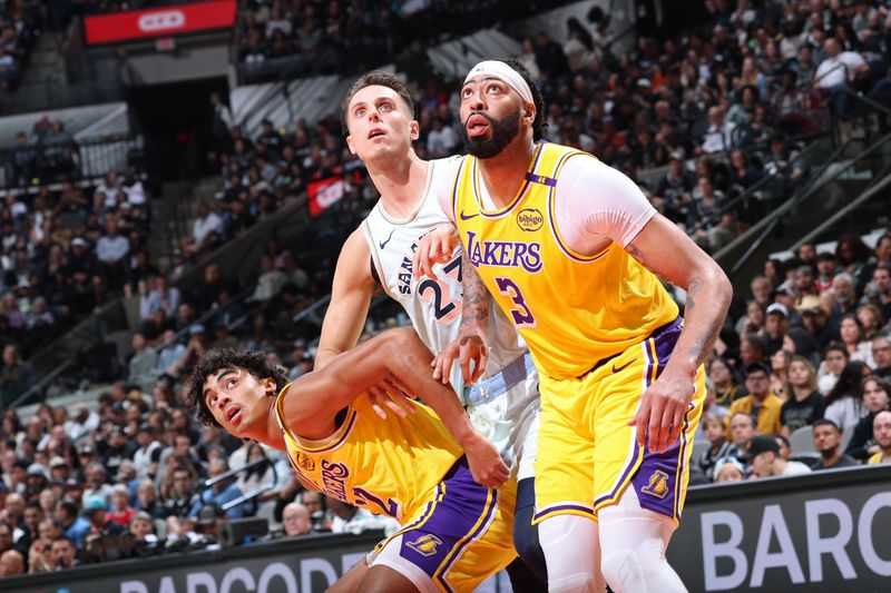 SAN ANTONIO, TX - NOVEMBER 27: Anthony Davis #3 and Max Christie #12 of the Los Angeles Lakers box out during the game against the San Antonio Spurs on November 27, 2024 at the Frost Bank Center in San Antonio, Texas. NOTE TO USER: User expressly acknowledges and agrees that, by downloading and or using this photograph, user is consenting to the terms and conditions of the Getty Images License Agreement. Mandatory Copyright Notice: Copyright 2024 NBAE (Photos by Jeff Haynes/NBAE via Getty Images)