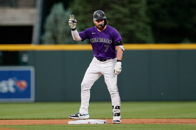 Jun 3, 2024; Denver, Colorado, USA; Colorado Rockies second baseman Brendan Rodgers (7) reacts from second on a double in the first inning against the Cincinnati Reds at Coors Field. Mandatory Credit: Isaiah J. Downing-USA TODAY Sports