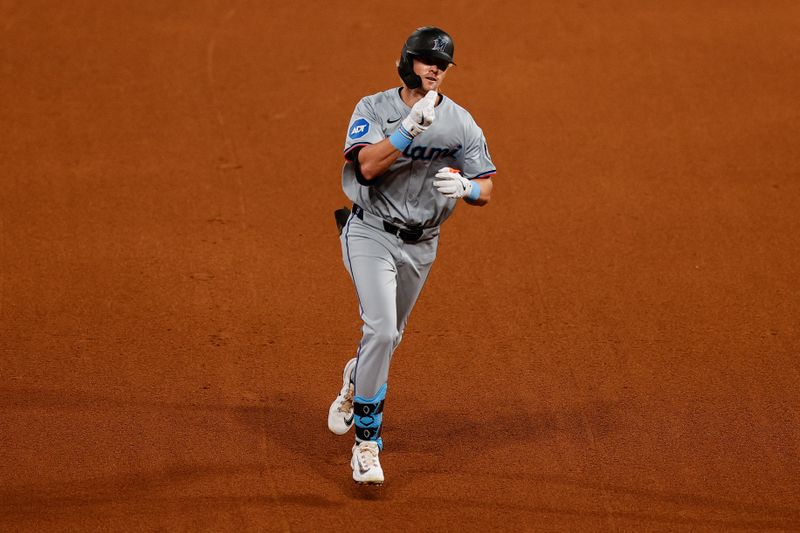 Aug 27, 2024; Denver, Colorado, USA; Miami Marlins center fielder Kyle Stowers (28) gestures as he rounds the bases on a solo home run in the fourth inning against the Colorado Rockies at Coors Field. Mandatory Credit: Isaiah J. Downing-USA TODAY Sports