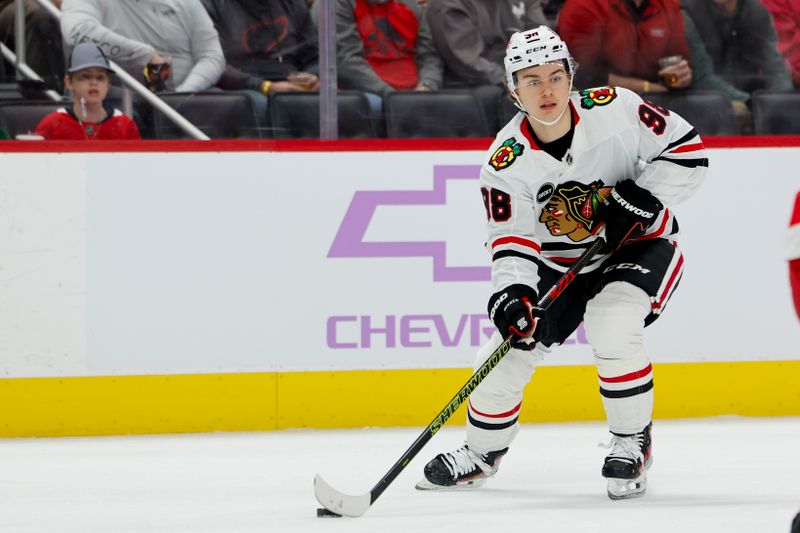 Nov 30, 2023; Detroit, Michigan, USA;  Chicago Blackhawks center Connor Bedard (98) skates with the puck in the first period against the Detroit Red Wings at Little Caesars Arena. Mandatory Credit: Rick Osentoski-USA TODAY Sports