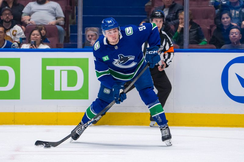 Sep 24, 2024; Vancouver, British Columbia, CAN;  Vancouver Canucks forward Linus Karlsson (94) shoots against the Seattle Kraken during the first period at Rogers Arena. Mandatory Credit: Bob Frid-Imagn Images