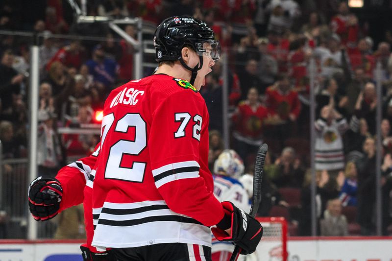 Feb 9, 2024; Chicago, Illinois, USA; Chicago Blackhawks defenseman Alex Vlasic (72) celebrates his goal against the New York Rangers during the first period at the United Center. Mandatory Credit: Daniel Bartel-USA TODAY Sports