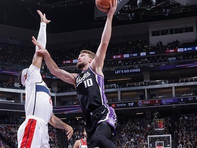 SACRAMENTO, CA - DECEMBER 18: Domantas Sabonis #10 of the Sacramento Kings drives to the basket during the game against the Washington Wizards on December 18, 2023 at Golden 1 Center in Sacramento, California. NOTE TO USER: User expressly acknowledges and agrees that, by downloading and or using this Photograph, user is consenting to the terms and conditions of the Getty Images License Agreement. Mandatory Copyright Notice: Copyright 2023 NBAE (Photo by Rocky Widner/NBAE via Getty Images)