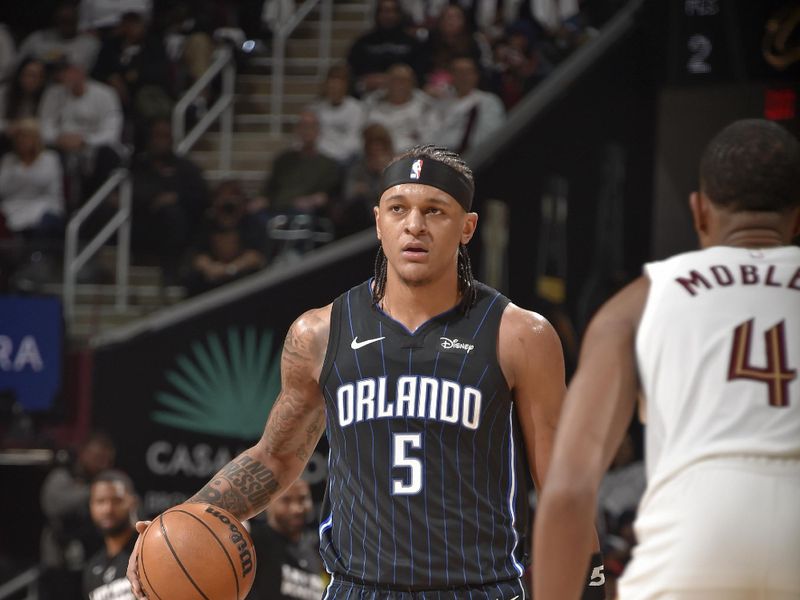 CLEVELAND, OH - APRIL 20: Paolo Banchero #5 of the Orlando Magic looks on during Round 1 Game 1 of the 2024 NBA Playoffs against the Cleveland Cavaliers on April 20, 2024 at Rocket Mortgage FieldHouse in Cleveland, Ohio. NOTE TO USER: User expressly acknowledges and agrees that, by downloading and/or using this Photograph, user is consenting to the terms and conditions of the Getty Images License Agreement. Mandatory Copyright Notice: Copyright 2024 NBAE (Photo by David Liam Kyle/NBAE via Getty Images)