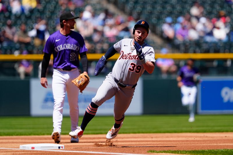 May 8, 2025; Denver, Colorado, USA; Detroit Tigers left fielder Zach McKinstry (39) heads home to score a run in the first inning against the Colorado Rockies at Coors Field. Mandatory Credit: Ron Chenoy-Imagn Images