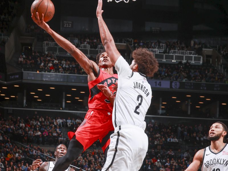 BROOKLYN, NY - OCTOBER 18: Ochai Agbaji #30 of the Toronto Raptors shoots the ball during the game on October 18, 2024 at Barclays Center in Brooklyn, New York. NOTE TO USER: User expressly acknowledges and agrees that, by downloading and or using this Photograph, user is consenting to the terms and conditions of the Getty Images License Agreement. Mandatory Copyright Notice: Copyright 2024 NBAE (Photo by Nathaniel S. Butler/NBAE via Getty Images)