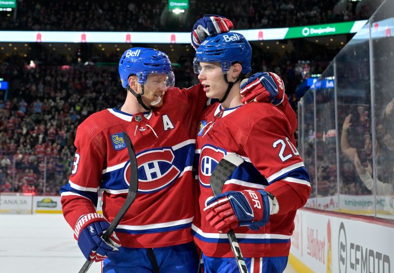 Feb 10, 2024; Montreal, Quebec, CAN; Montreal Canadiens forward Juraj Slafkovsky (20) celebrates with defenseman Mike Matheson (8) after scoring a goal against the Dallas Stars during the second period at the Bell Centre. Mandatory Credit: Eric Bolte-USA TODAY Sports