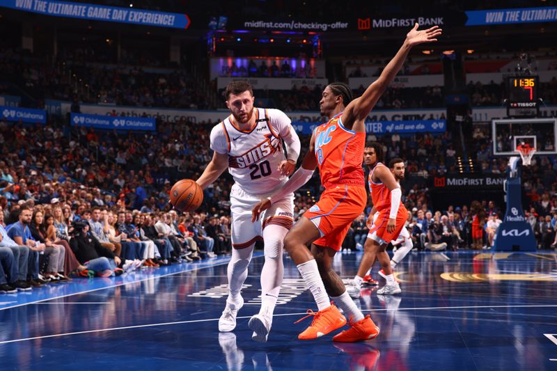 OKLAHOMA CITY, OK - NOVEMBER 15: Jusuf Nurkic #20 of the Phoenix Suns handles the ball during the game against the Oklahoma City Thunder during the Emirates NBA Cup game on November 15, 2024 at Paycom Center in Oklahoma City, Oklahoma. NOTE TO USER: User expressly acknowledges and agrees that, by downloading and or using this photograph, User is consenting to the terms and conditions of the Getty Images License Agreement. Mandatory Copyright Notice: Copyright 2024 NBAE (Photo by Zach Beeker/NBAE via Getty Images)