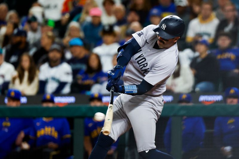 Sep 17, 2024; Seattle, Washington, USA; New York Yankees catcher Austin Wells (28) hits a three-run double against the Seattle Mariners during the sixth inning at T-Mobile Park. Mandatory Credit: Joe Nicholson-Imagn Images