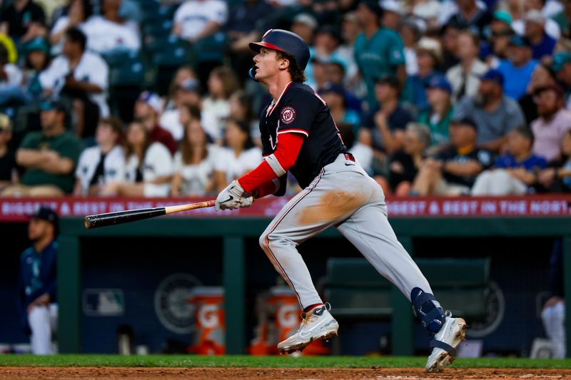 May 28, 2025; Seattle, Washington, USA; Washington Nationals center fielder Robert Hassell III (57) hits a solo-home run against the Seattle Mariners during the eighth inning at T-Mobile Park. Mandatory Credit: Joe Nicholson-Imagn Images