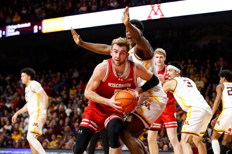 Jan 23, 2024; Minneapolis, Minnesota, USA; Wisconsin Badgers forward Tyler Wahl (5) drives towards the basket as Minnesota Golden Gophers forward Pharrel Payne (21) defends during the second half at Williams Arena. Mandatory Credit: Matt Krohn-USA TODAY Sports
