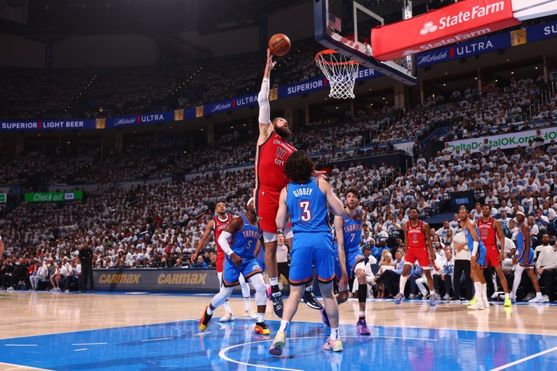 OKLAHOMA CITY, OK - APRIL 24: Jonas Valanciunas #17 of the New Orleans Pelicans drives to the basket during the game against the Oklahoma City Thunder during Round 1 Game 2 of the 2024 NBA Playoffs on April 24, 2024 at Paycom Arena in Oklahoma City, Oklahoma. NOTE TO USER: User expressly acknowledges and agrees that, by downloading and or using this photograph, User is consenting to the terms and conditions of the Getty Images License Agreement. Mandatory Copyright Notice: Copyright 2024 NBAE (Photo by Zach Beeker/NBAE via Getty Images)