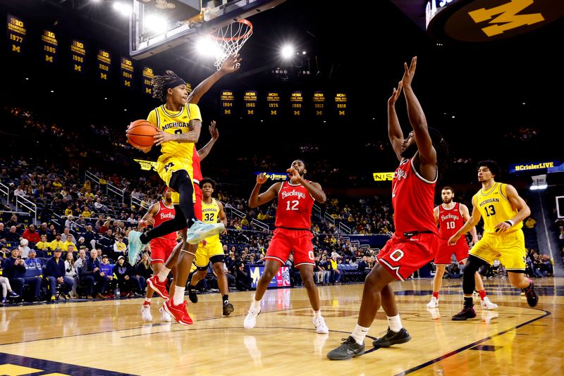 Jan 15, 2024; Ann Arbor, Michigan, USA; Michigan Wolverines forward Tray Jackson (2) passes in the first half against the Ohio State Buckeyes at Crisler Center. Mandatory Credit: Rick Osentoski-USA TODAY Sports