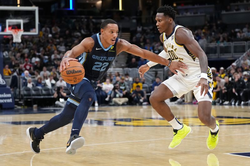 INDIANAPOLIS, INDIANA - OCTOBER 14: Desmond Bane #22 of the Memphis Grizzlies drives against Bennedict Mathurin #00 of the Indiana Pacers in the third quarter during a preseason game at Gainbridge Fieldhouse on October 14, 2024 in Indianapolis, Indiana. NOTE TO USER: User expressly acknowledges and agrees that, by downloading and or using this photograph, User is consenting to the terms and conditions of the Getty Images License Agreement. (Photo by Dylan Buell/Getty Images)