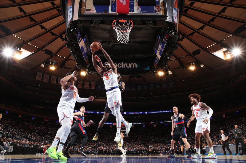 NEW YORK, NY - MARCH 25:  Precious Achiuwa #5 of the New York Knicks grabs a rebound during the game against the Detroit Pistons on March 25, 2024 at Madison Square Garden in New York City, New York.  NOTE TO USER: User expressly acknowledges and agrees that, by downloading and or using this photograph, User is consenting to the terms and conditions of the Getty Images License Agreement. Mandatory Copyright Notice: Copyright 2024 NBAE  (Photo by David L. Nemec /NBAE via Getty Images)