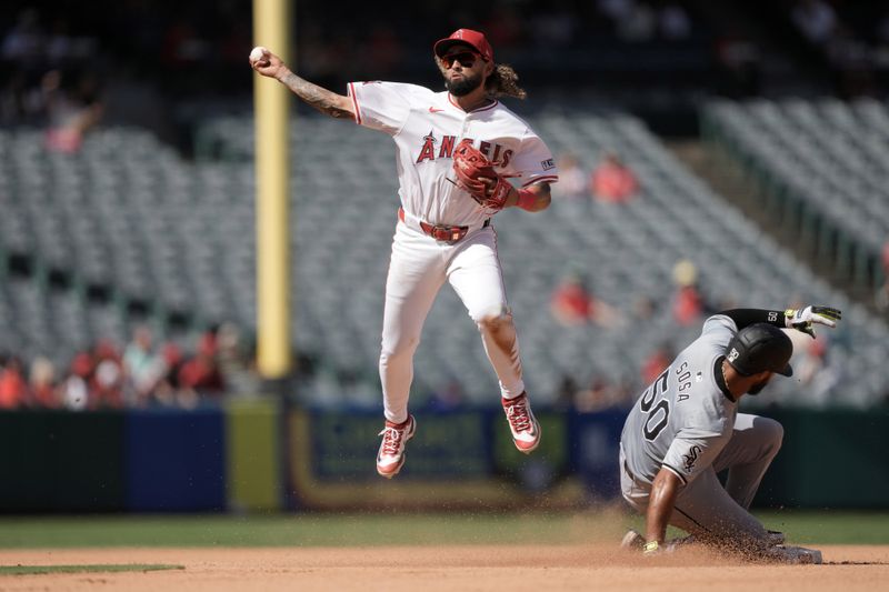 Sep 18, 2024; Anaheim, California, USA; Los Angeles Angels shortstop Jack Lopez (10) forces out Chicago White Sox second baseman Lenyn Sosa (50) out at second base in the seventh inning at Angel Stadium. Mandatory Credit: Kirby Lee-Imagn Images